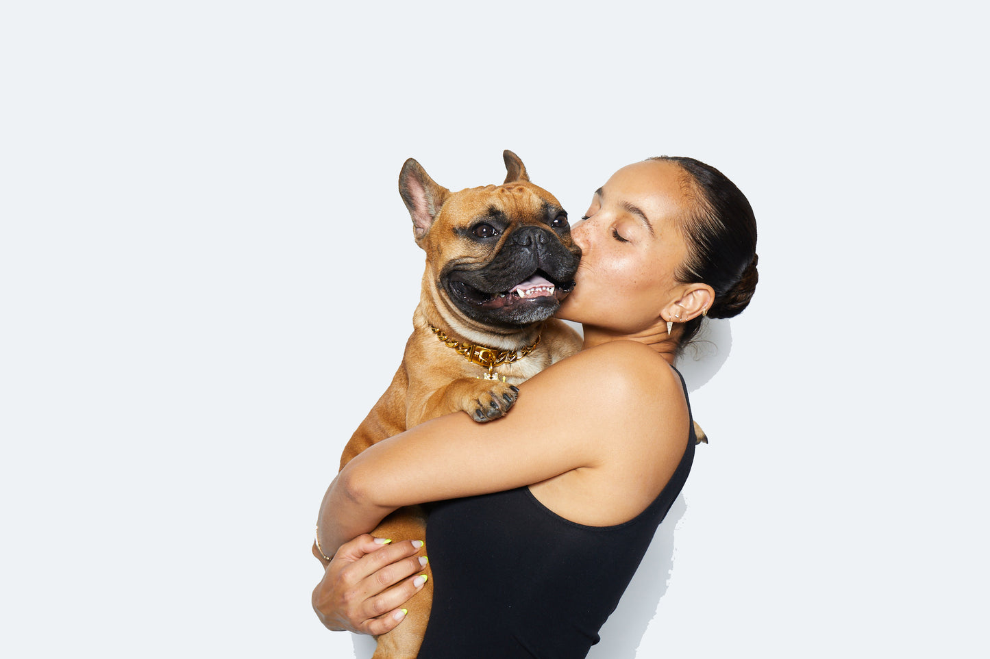 Trill Paws Founder Rachel Jones and french bulldog kevin in front of white background