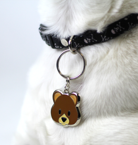 Teddy brown and beige enamel pet ID tag on black collar and white dog | Trill Paws 