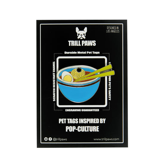Load image into Gallery viewer, blue ramen bowl egg noodle enamel pet id tag on black packaging card | trill paws
